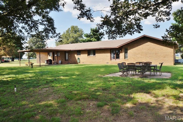 7526 State Highway 164, Cardwell, MO 63829 - back of house featuring brick siding, a yard, and a patio area