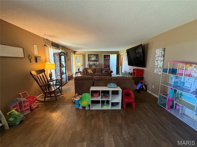 7526 State Highway 164, Cardwell, MO 63829 - recreation room with a textured ceiling and wood-type flooring