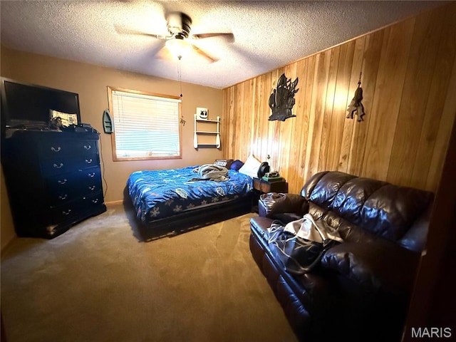 7526 State Highway 164, Cardwell, MO 63829 - bedroom with wood walls, carpet, a textured ceiling, and ceiling fan