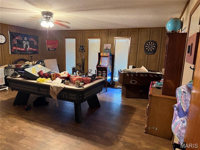 7526 State Highway 164, Cardwell, MO 63829 - game room featuring a textured ceiling, a ceiling fan, billiards, wood-type flooring, and wood walls