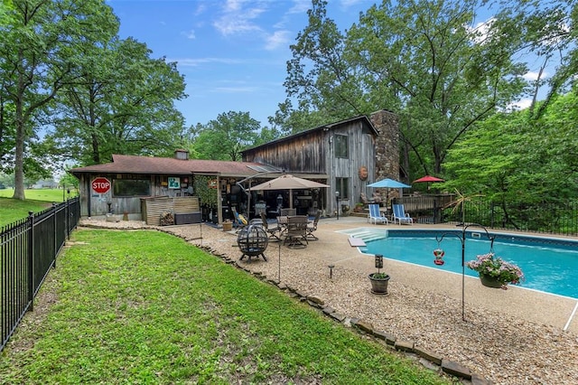 view of swimming pool with a patio