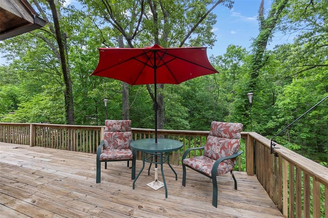 deck featuring a wooded view