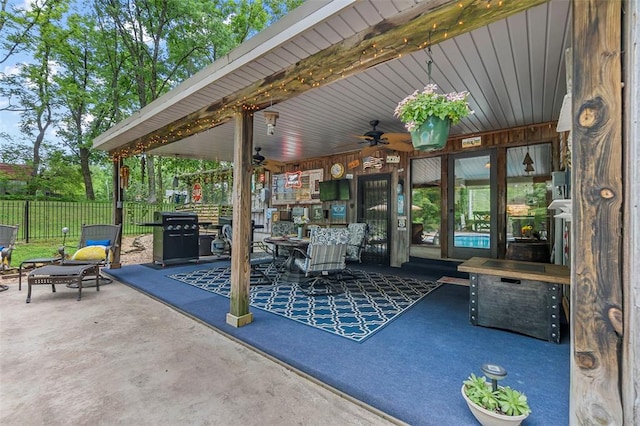 view of patio featuring fence, a ceiling fan, and area for grilling