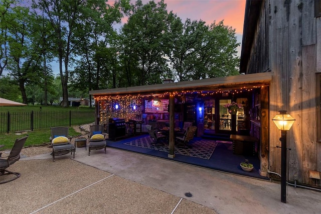 view of patio featuring fence and an outdoor living space