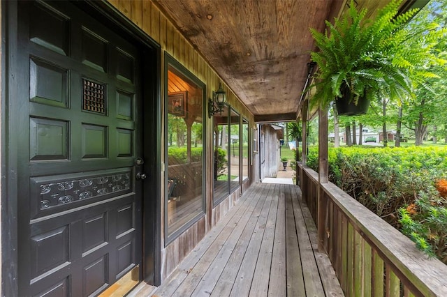 wooden terrace with a porch