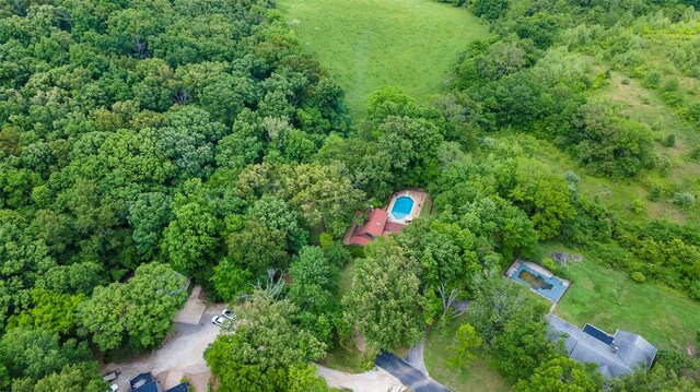 aerial overview of property's location with a forest