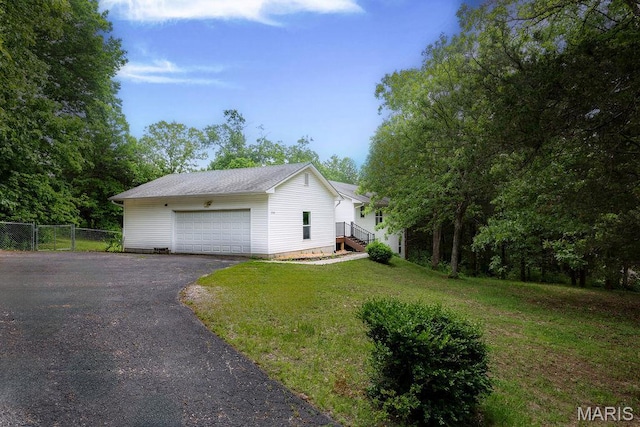 524 Arrowhead Pt, Cedar Hill, MO 63016 - view of side of property featuring asphalt driveway and a garage