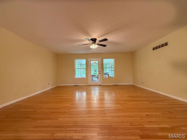 524 Arrowhead Pt, Cedar Hill, MO 63016 - spare room with ceiling fan, light wood-style floors, and a textured ceiling