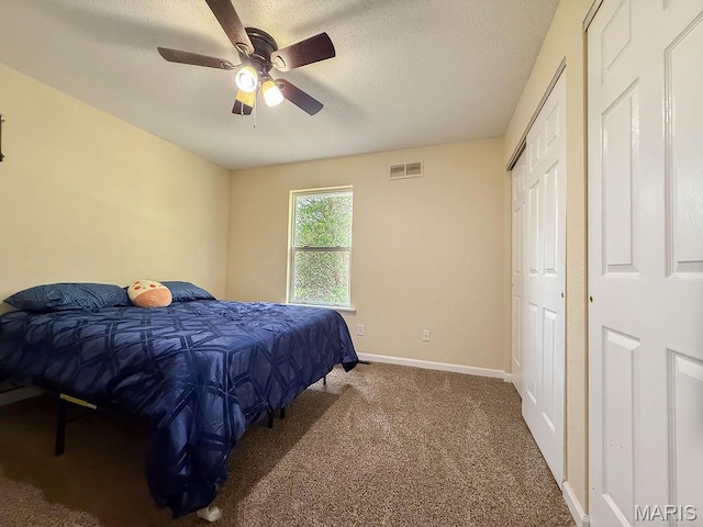 524 Arrowhead Pt, Cedar Hill, MO 63016 - carpeted bedroom featuring a textured ceiling and a ceiling fan