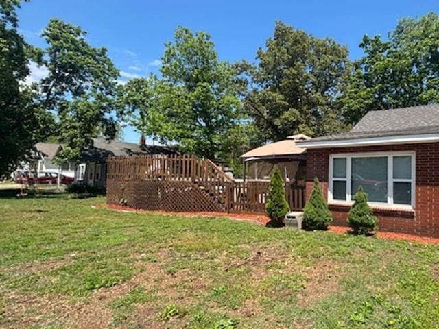 313 W Crumb Ave, Bernie, MO 63822 - view of grassy yard with a wooden deck and a gazebo