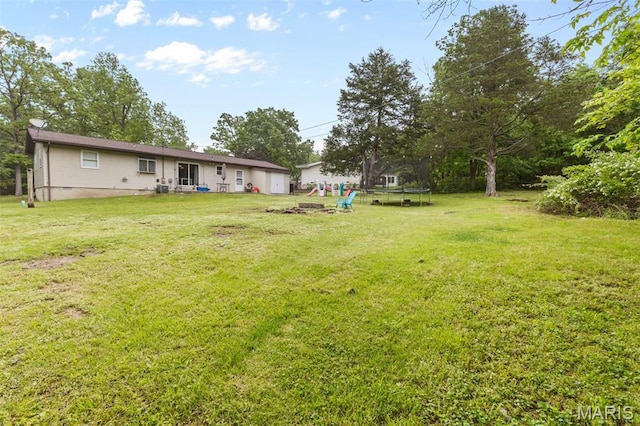 1414 Rue Camille, Bonne Terre, MO 63628 - view of grassy yard featuring a trampoline