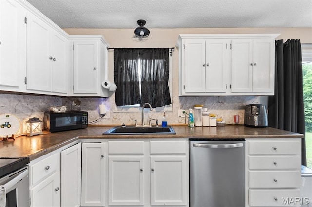 1414 Rue Camille, Bonne Terre, MO 63628 - kitchen featuring stainless steel dishwasher, black microwave, white cabinetry, backsplash, and a textured ceiling