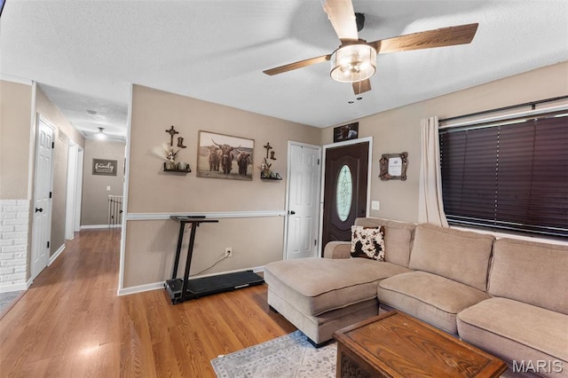 1414 Rue Camille, Bonne Terre, MO 63628 - living area featuring a ceiling fan, wood finished floors, and a textured ceiling
