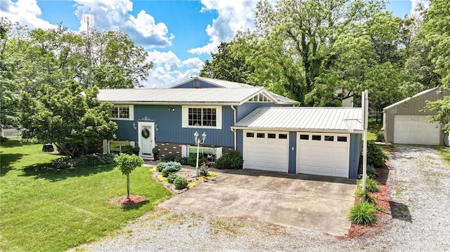 23571 Peppermill Ln, Hettick, IL 62649 - raised ranch featuring a front yard, metal roof, driveway, and a garage