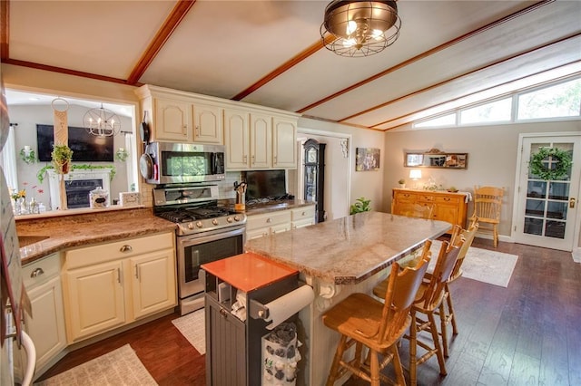 23571 Peppermill Ln, Hettick, IL 62649 - kitchen featuring stainless steel appliances, a chandelier, a breakfast bar, backsplash, and a kitchen island