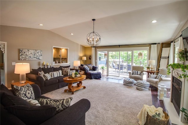 23571 Peppermill Ln, Hettick, IL 62649 - carpeted living area with a chandelier, vaulted ceiling, a fireplace, and recessed lighting