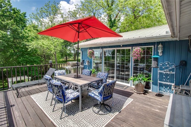 23571 Peppermill Ln, Hettick, IL 62649 - wooden deck with outdoor dining space and view of wooded area
