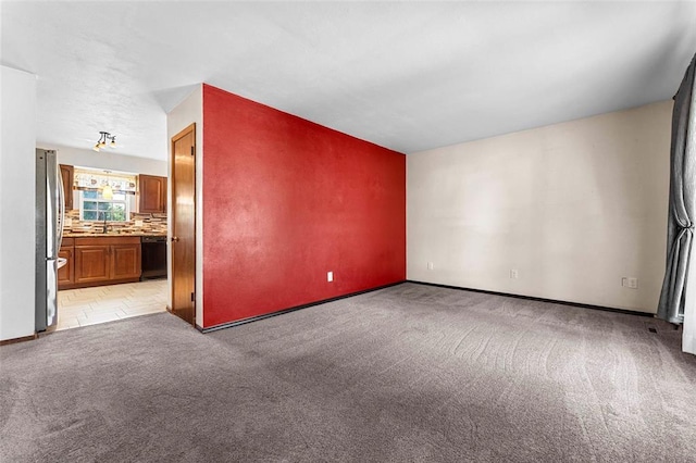 226 Ridgeview Dr, Columbia, IL 62236 - unfurnished room featuring light colored carpet, baseboards, and a sink