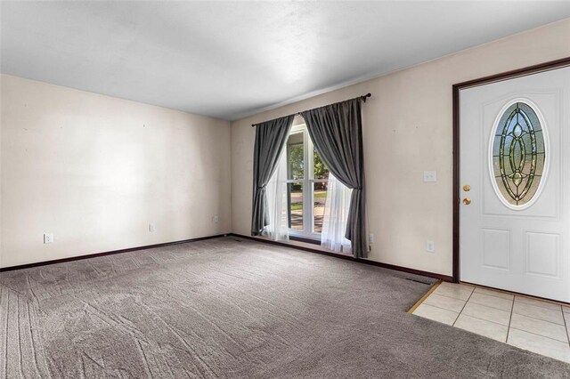 226 Ridgeview Dr, Columbia, IL 62236 - carpeted entrance foyer with baseboards and tile patterned flooring