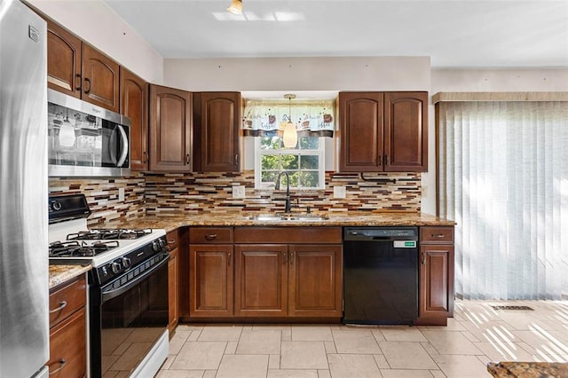 226 Ridgeview Dr, Columbia, IL 62236 - kitchen with appliances with stainless steel finishes, a sink, backsplash, and light stone countertops