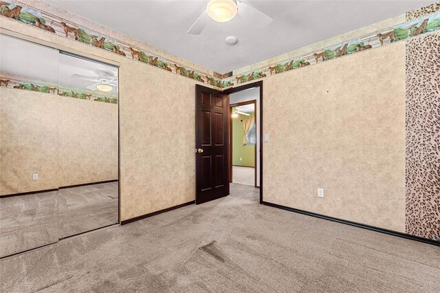 226 Ridgeview Dr, Columbia, IL 62236 - unfurnished bedroom featuring light carpet, a closet, a ceiling fan, and baseboards
