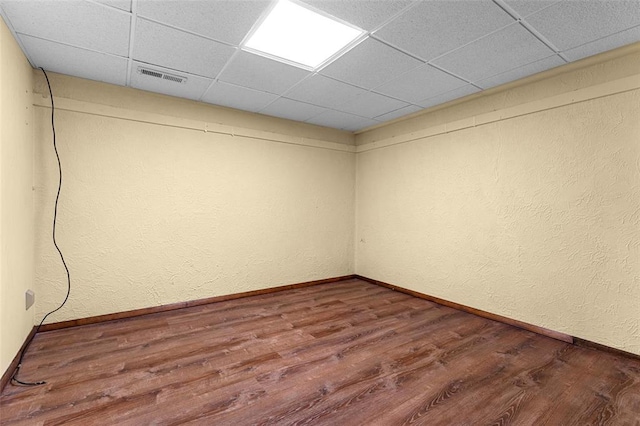 226 Ridgeview Dr, Columbia, IL 62236 - empty room with dark wood-style flooring, a drop ceiling, and baseboards