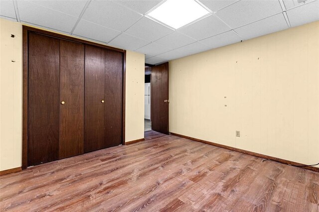 226 Ridgeview Dr, Columbia, IL 62236 - unfurnished bedroom featuring wood finished floors, a paneled ceiling, a closet, and baseboards