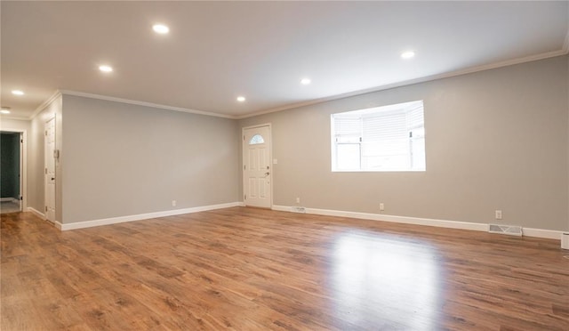 2137 Inman Rd, Poplar Bluff, MO 63901 - unfurnished living room featuring ornamental molding, recessed lighting, baseboards, and wood finished floors