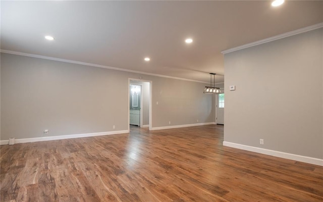 2137 Inman Rd, Poplar Bluff, MO 63901 - unfurnished room with crown molding, baseboards, recessed lighting, wood finished floors, and a chandelier