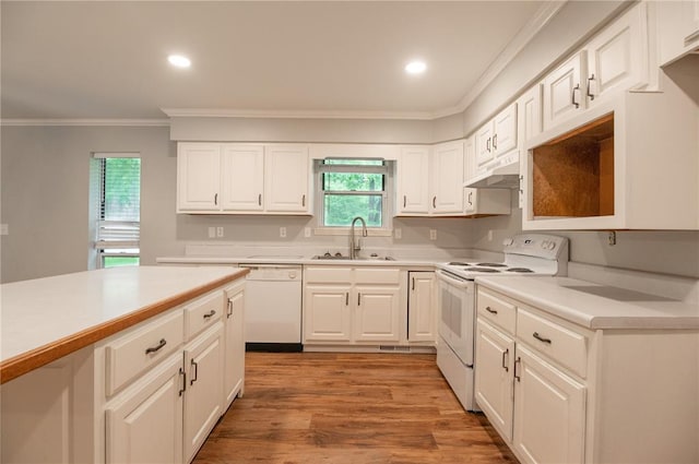 2137 Inman Rd, Poplar Bluff, MO 63901 - kitchen with white appliances, a sink, ornamental molding, under cabinet range hood, and recessed lighting