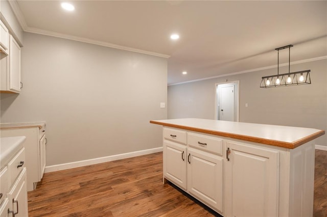 2137 Inman Rd, Poplar Bluff, MO 63901 - kitchen featuring crown molding, wood finished floors, white cabinetry, recessed lighting, and light countertops