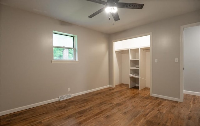 2137 Inman Rd, Poplar Bluff, MO 63901 - unfurnished bedroom with wood finished floors, baseboards, a ceiling fan, and a closet