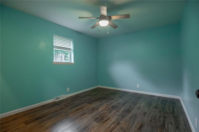 2137 Inman Rd, Poplar Bluff, MO 63901 - empty room featuring dark wood-type flooring, baseboards, and ceiling fan