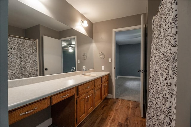 2137 Inman Rd, Poplar Bluff, MO 63901 - bathroom with wood finished floors, vanity, and baseboards