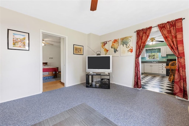 5611 State Route 156, Waterloo, IL 62298 - carpeted living room featuring a ceiling fan, a sink, and baseboards