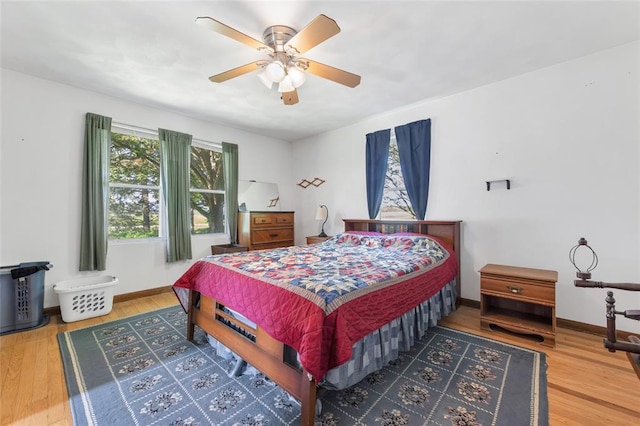 5611 State Route 156, Waterloo, IL 62298 - bedroom with wood finished floors, baseboards, and a ceiling fan
