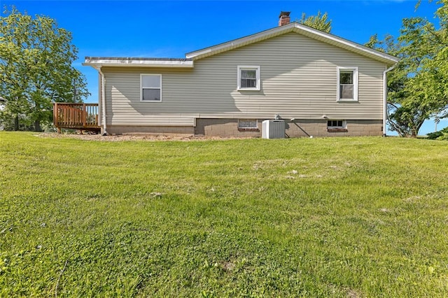 5611 State Route 156, Waterloo, IL 62298 - rear view of property with cooling unit, a yard, and a deck
