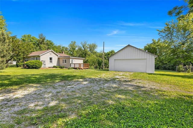5611 State Route 156, Waterloo, IL 62298 - view of grassy yard featuring an outdoor structure, a garage, and a wooden deck