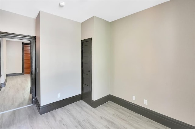 4541 Oakland Ave, Saint Louis, MO 63115 - unfurnished bedroom with wood finished floors and baseboards