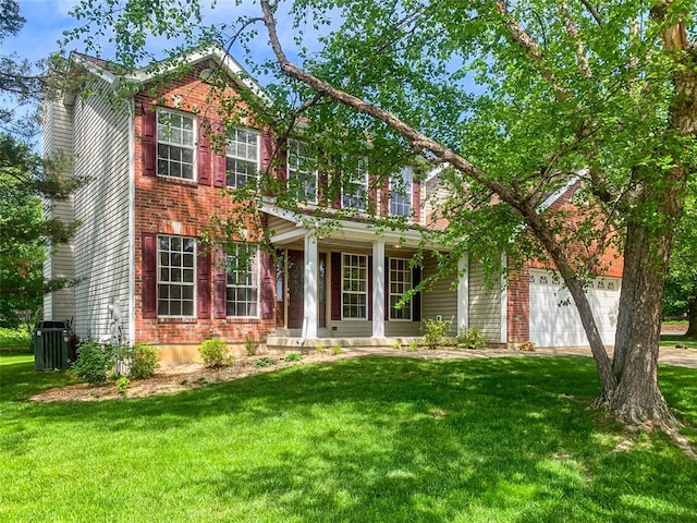 view of front of house featuring a front yard, brick siding, driveway, central AC, and an attached garage