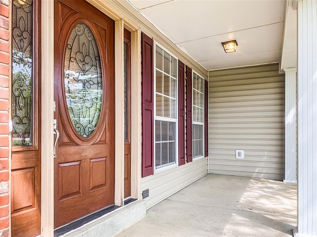 doorway to property with a porch