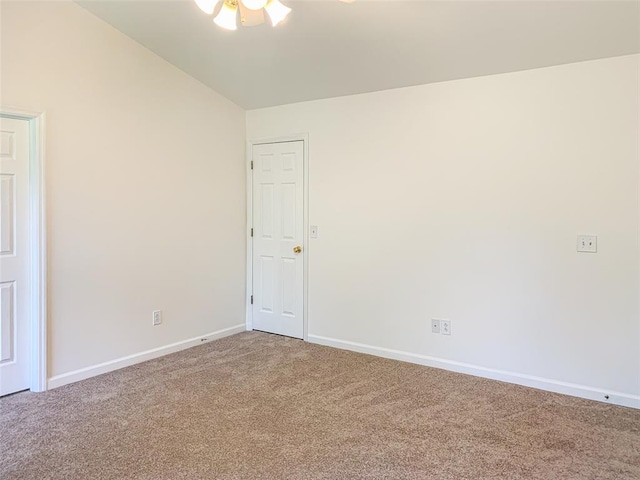spare room featuring carpet floors, baseboards, and a ceiling fan