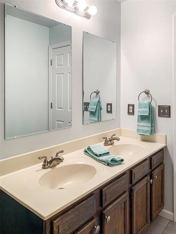 full bathroom with double vanity and tile patterned flooring