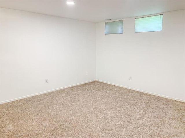 basement with carpet flooring, baseboards, and recessed lighting
