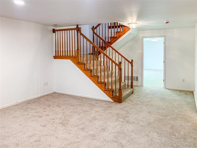 stairs with carpet flooring and baseboards