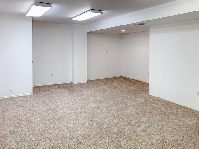 finished basement featuring carpet and baseboards