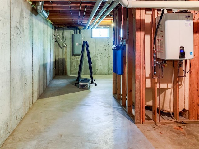 below grade area featuring water heater and electric panel