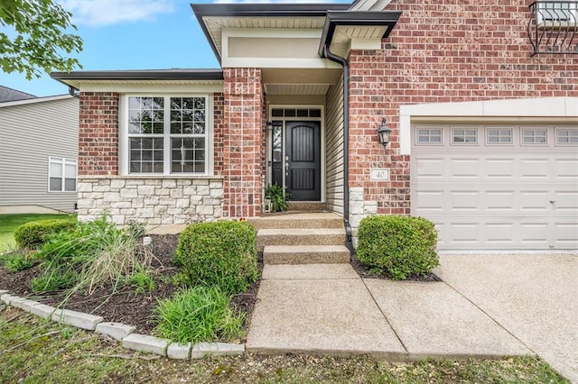 40 Burnside Ct, Frontier Township, MO 63303 - view of exterior entry with stone siding, an attached garage, and brick siding