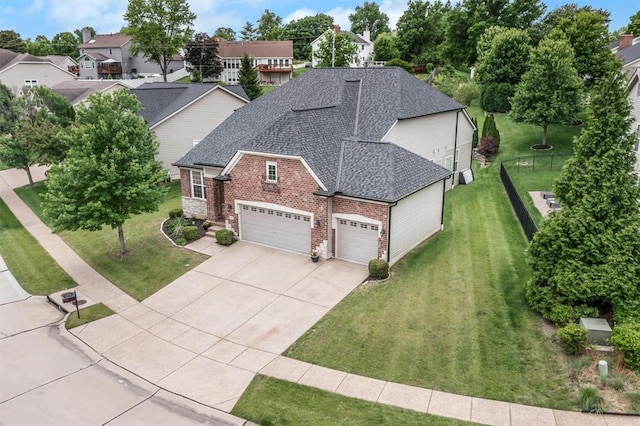 40 Burnside Ct, Frontier Township, MO 63303 - view of front facade featuring brick siding, roof with shingles, an attached garage, and driveway