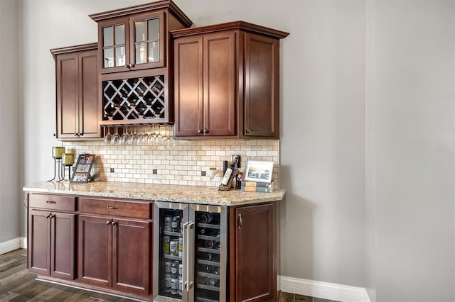40 Burnside Ct, Frontier Township, MO 63303 - indoor dry bar featuring wine cooler, baseboards, backsplash, and dark wood finished floors